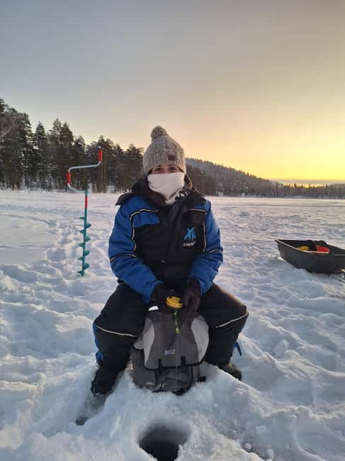 Arctic Fishing & Open Fire Cooking - Drilling through the frozen lake