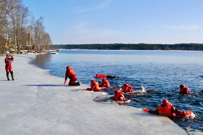 Arctic Ice floating in Puumala - Putting on the waterproof safety suit
