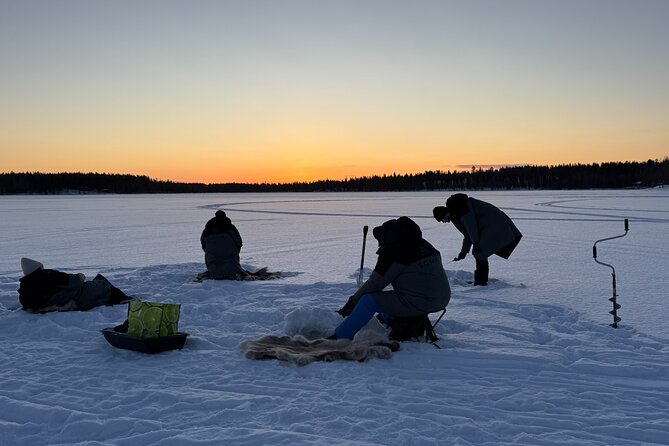 Authentic Reindeer Experience and Ice Fish with Lunch in the Wild - Warming Up at Soma Hideout