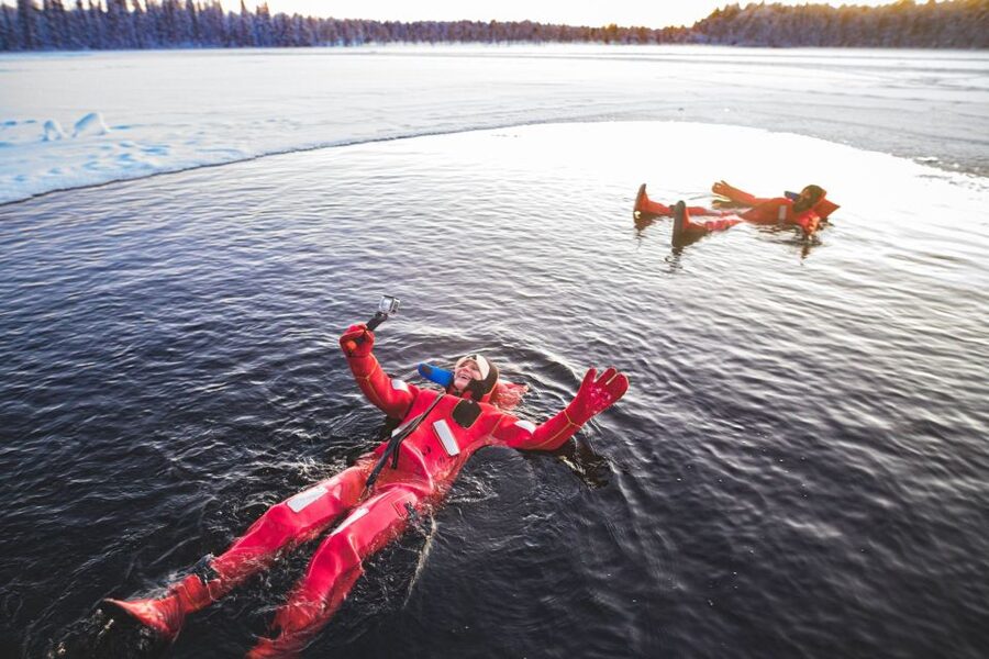 Daytime Ice Floating Rovaniemi, Frozen Lake Experience - Entering the icy water