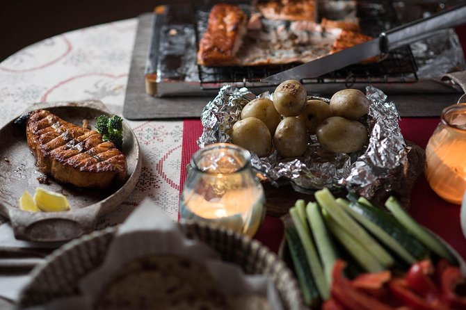 Full Day Lapland Tour, including Lunch and Dinner - Salmon by the fire in a warm cottage