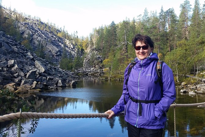 Guided easy hike in Finland deepest gorge in Pyhä-Luosto National Park - Walking toward Pyhänkasteenputous Waterfall