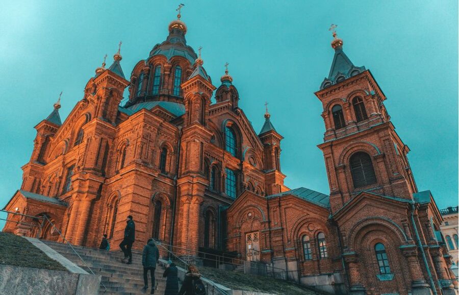 Helsinki: Small-Group Walking Tour with City Planner Guide - Uspenski Cathedral shows Helsinki’s eastern influence