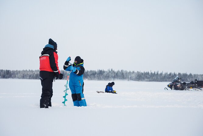Ice Fishing and Snowmobile Safari Combo in Lapland - Sausages and stories beside the fire