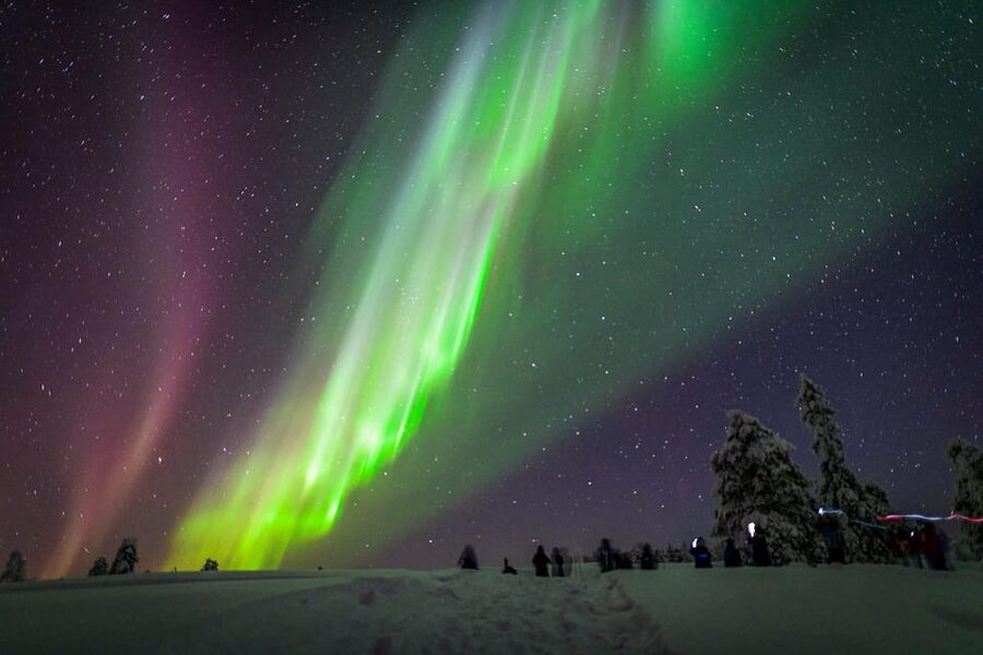 Inari: Northern Lights Hunt Snowmobile Safari - Leaving town after dark