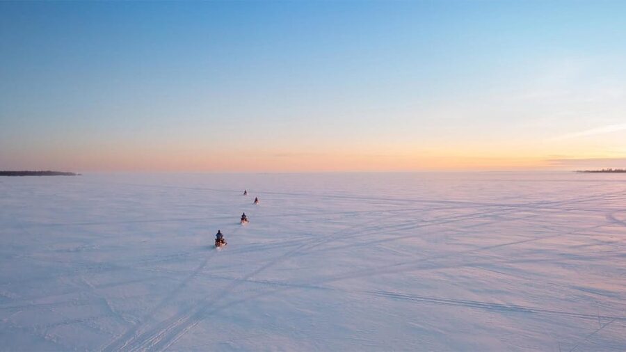 Kemi-Tornio: Ice Fishing Safari with Snowmobiles - Riding a snowmobile over the frozen Bothnian Bay