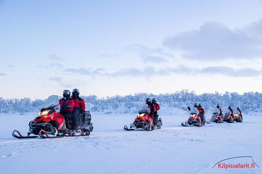 Kilpisjärvi: Border of Three Countries Snowmobile Safari - Riding through the snowy birch forest