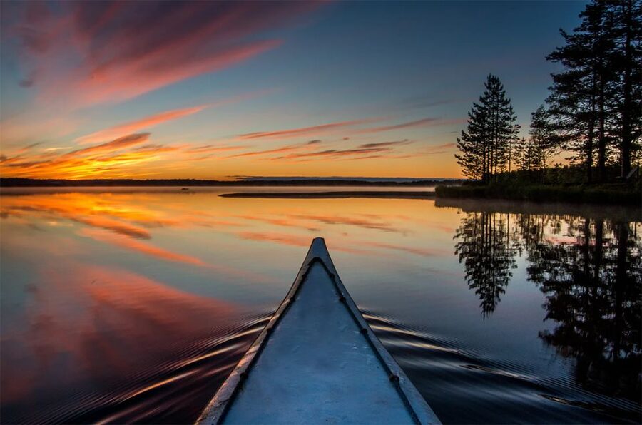 Lapland: Canoeing Trip with Reindeer and Husky Farm Tour - From farm paths to a quiet Finnish lake
