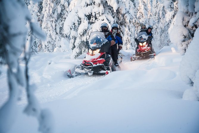 Lappish Lunch Break -Snowmobiling, ice fishing and tasty food - Learning the Finnish way to fish through ice