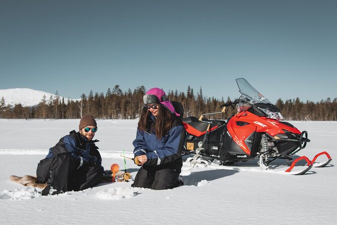 Lappish Lunch Break -Snowmobiling, ice fishing and tasty food - Snowmobiling across forests, rivers, and open snow