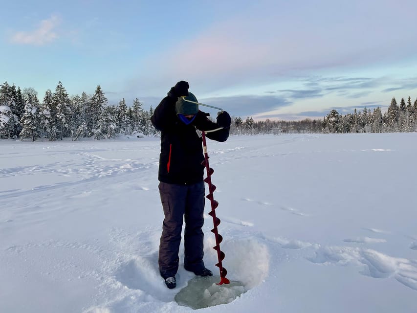 Levi: Ice Fishing Trip in a small group - Learning to drill through the ice