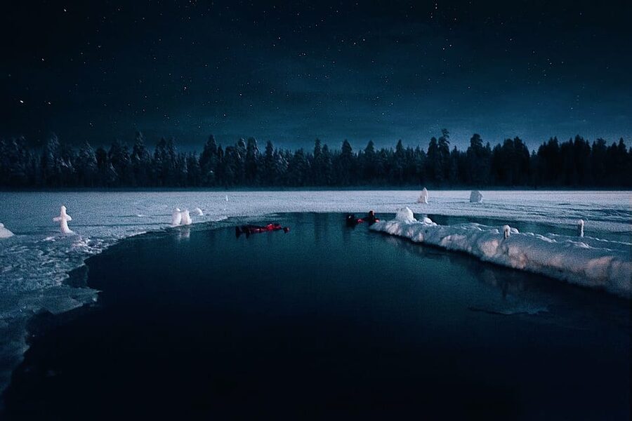 Levi: Ice Floating and Northern Lights Tour - Getting fitted with the Arctic rescue suit