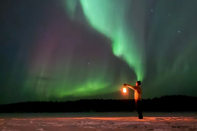 Northern Lights Adventure in the Wild with Campfire Treats - A traditional cabin and a warm Finnish evening