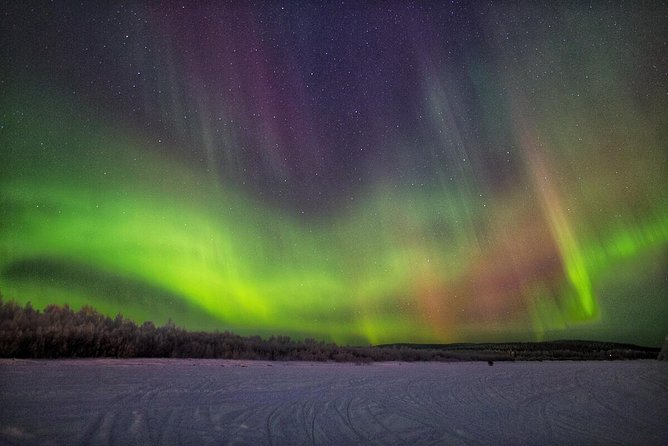 Northern Lights Hunting with Snowmobiles - Cold-weather comfort and the quiet between stops
