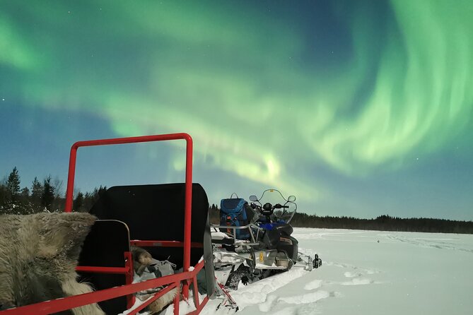 Northern Lights Sledge Ride - Through the forest behind a snowmobile