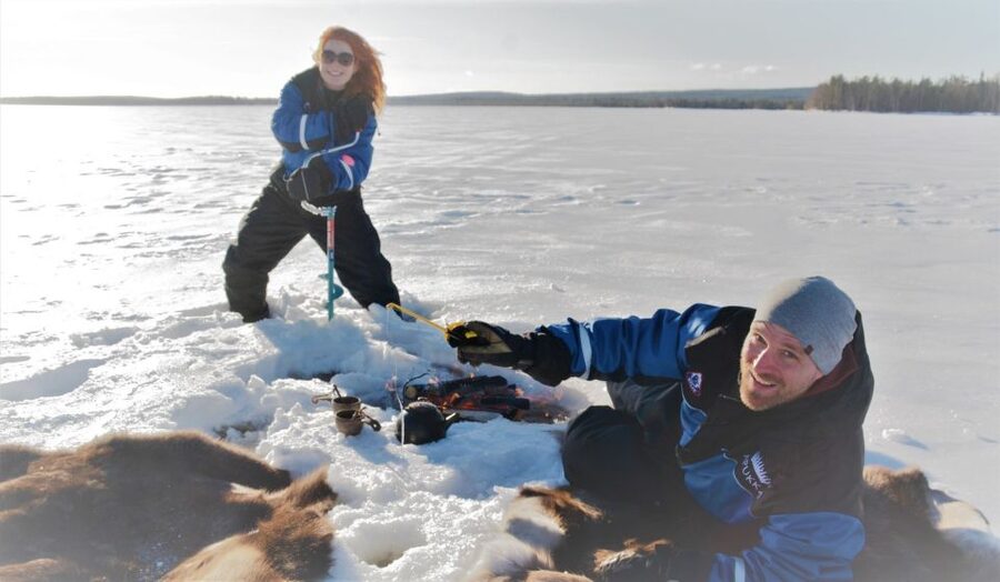 Rovaniemi: Ice-Fishing like a Finn - Reindeer skins, fire, snacks, and warm drinks