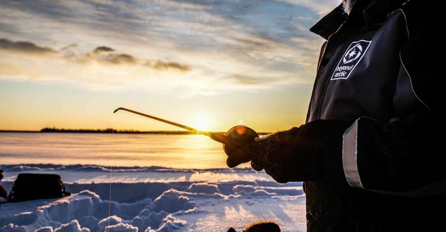 Rovaniemi: Ice Fishing on a Frozen Lake with BBQ and Photos - A Frozen Lake Made for Photos