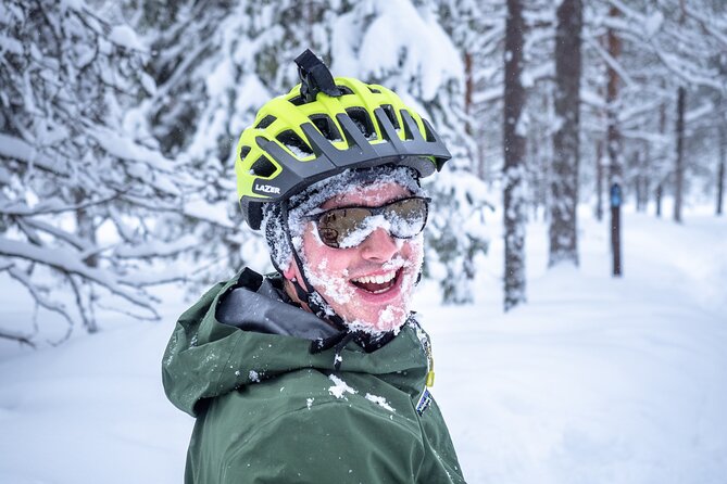 Scenic electric fat bike group ride in Rovaniemi - A quick stop at Lumberjack’s Candle Bridge