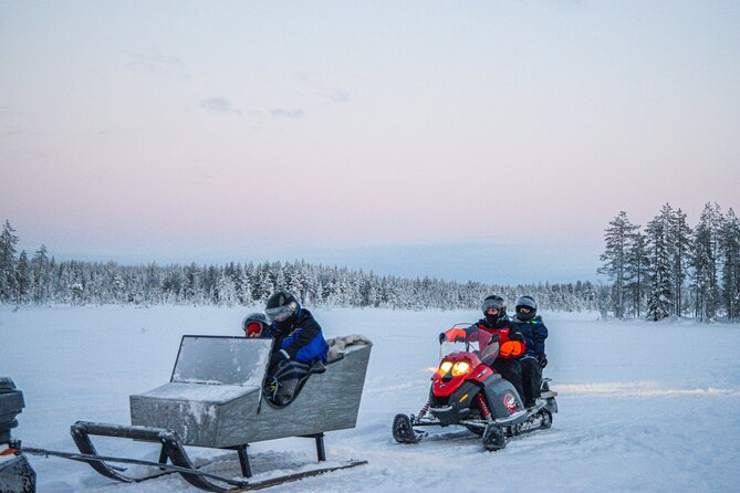 Small-Group Snowmobile Experience in Rovaniemi - A break beside the fire