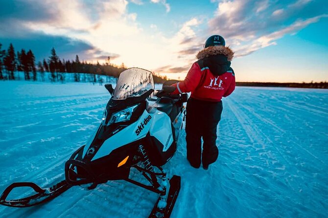 Snowmobile and Ice Fishing Experience - Drilling through nearly a meter of ice