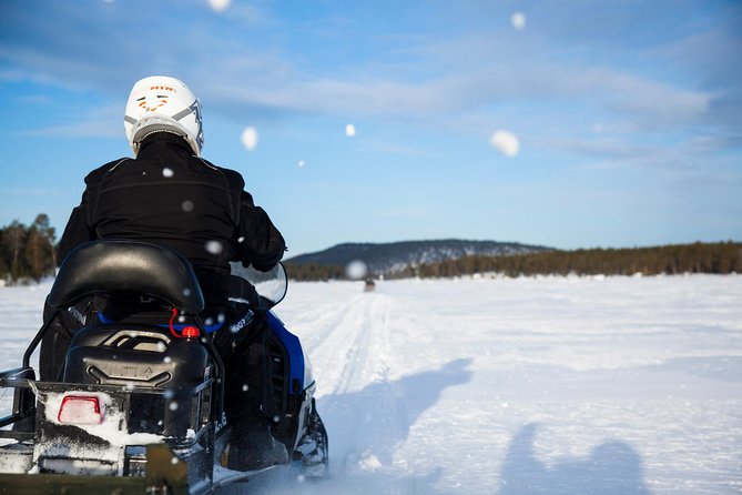 Snowmobile Safari to Lake Inari, meet & feed Reindeers, Lunch - The long, quiet run across frozen water