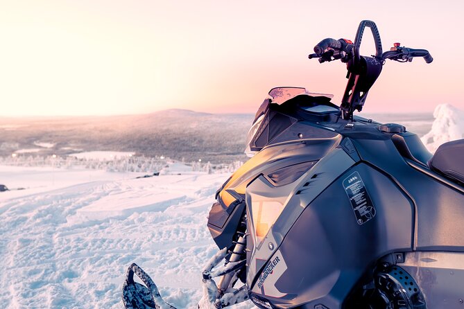 Snowmobile Tours in Rovaniemi Lapland - Through the snowy forest and out to the frozen lake