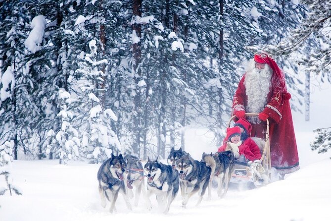 Snowmobiles and Huskies - Getting dressed at the safari office