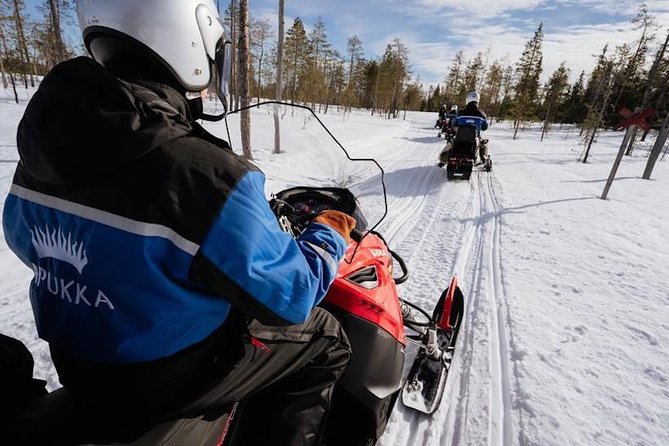 Snowmobiling and ice fishing in Apukka Resort, Rovaniemi - Snowmobiling from Apukka through the Arctic forest