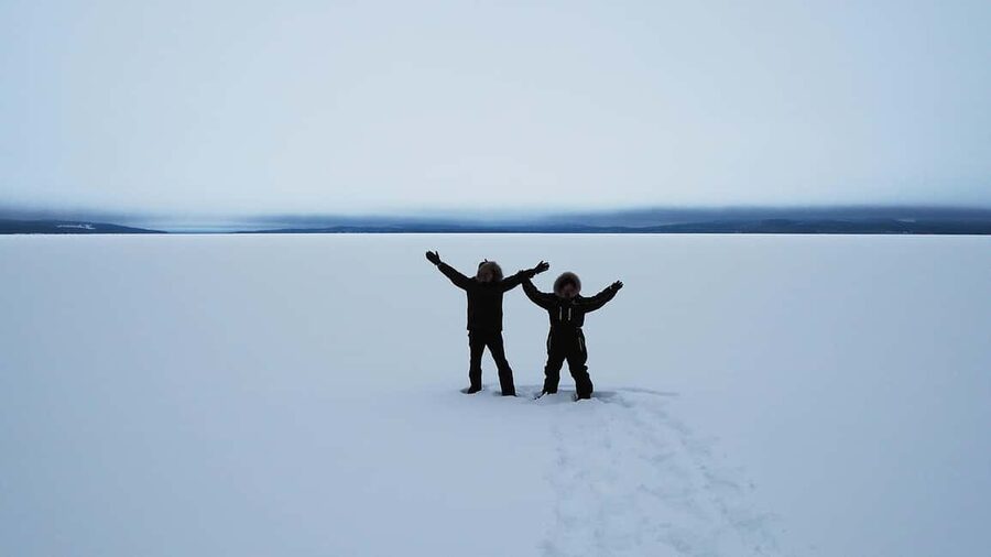 Snowshoe experience with traditional beverages in Lapland - Forest snow or open lake scenery