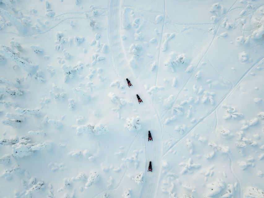 Ylläs: Snowmobile Adventure with Ice Fishing - Fire-cooked soup in a traditional tipi
